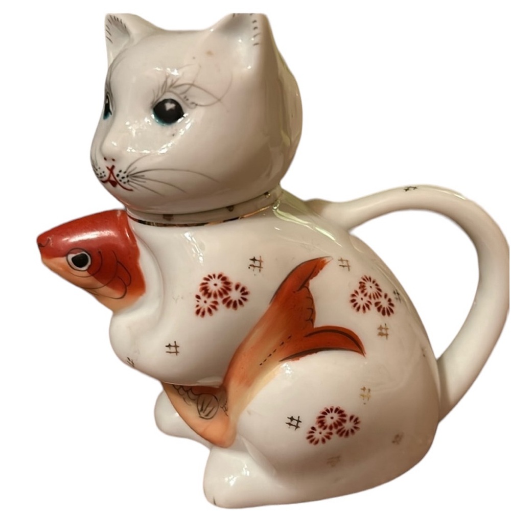 Vintage cat teapot, or dispenser holding Koi fish